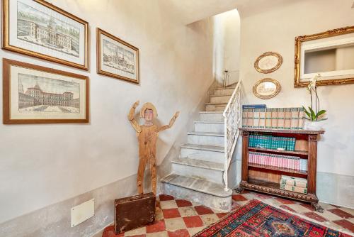a statue of a person in a room with stairs at Casa Monella in La Spezia