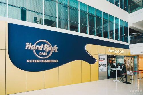 a hard rock cafe sign in a building at Teega Suites Seaview by VDO Homestay in Nusajaya