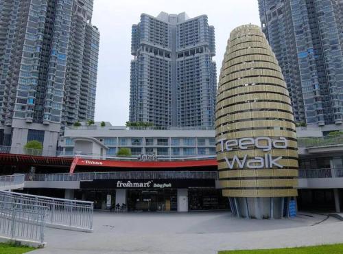 a building in a city with tall buildings at Teega Suites Seaview by VDO Homestay in Nusajaya