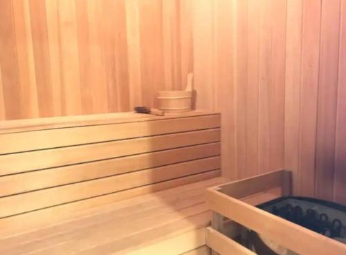 a room with a sauna with a tub and a chair at Teega Suites Seaview by VDO Homestay in Nusajaya
