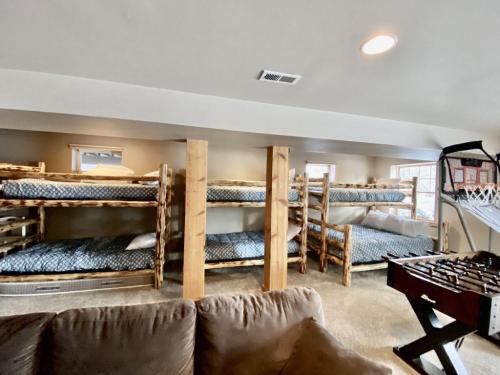 a room with a bunch of bunk beds at Brown Bear Chalet in Whitefish