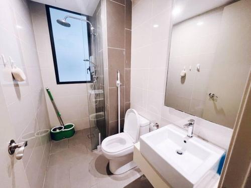 a bathroom with a toilet and a sink and a mirror at [PROMO]Connected train 2 Bedroom ABOVE MALL (22) in Kuala Lumpur