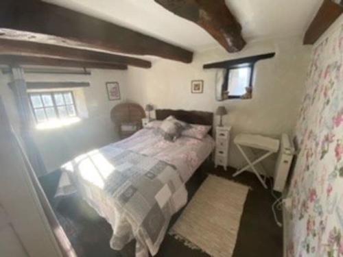 En eller flere senge i et værelse på Tardoire cottage