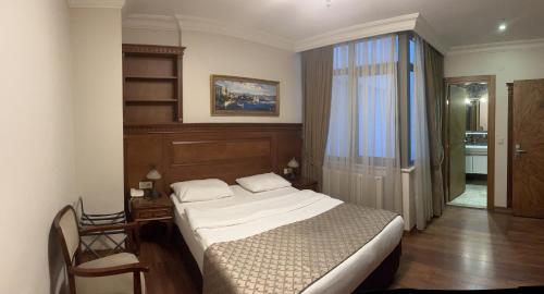 a bedroom with a large bed and a window at Hotel Blisstanbul in Istanbul