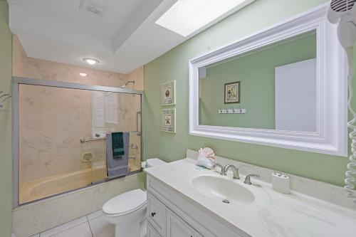 a bathroom with a sink and a toilet and a shower at 429 North Barfield Drive in Marco Island