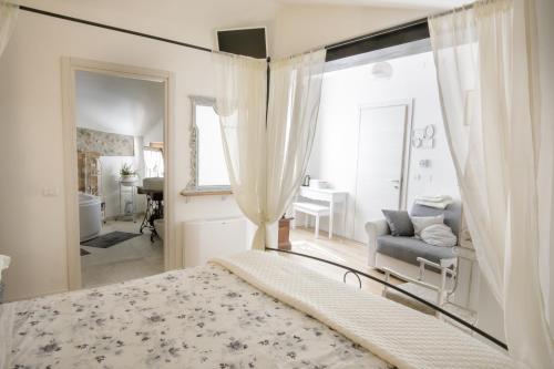 a bedroom with a bed and a mirror at GardaBeds Adults Only in Castelnuovo del Garda