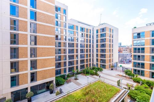 an aerial view of buildings in a city at Hilltop Serviced Apartments - Ancoats in Manchester