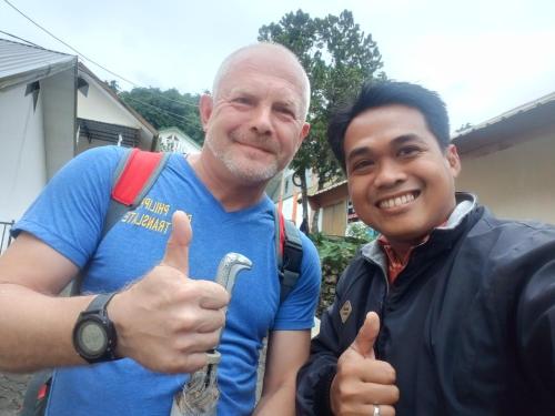 a man giving a thumbs up next to another man at NUANSA HOMESTAY Authentic&Hospitality in Rantepao