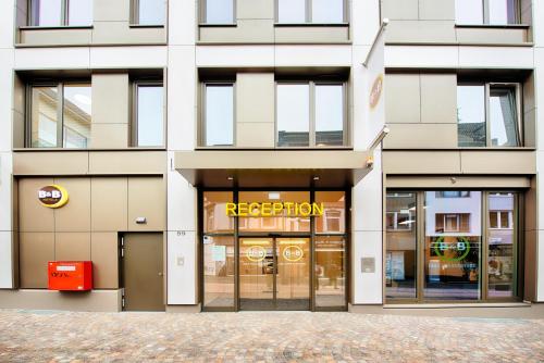 a facade of a building with a rejection sign on it at B&B Hotel Aachen-City in Aachen