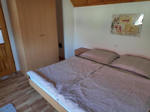 Postel nebo postele na pokoji v ubytování Domček Janina