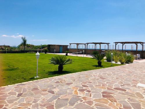 a park with a grassy field and a pathway at Edoardo e Franca in Minturno
