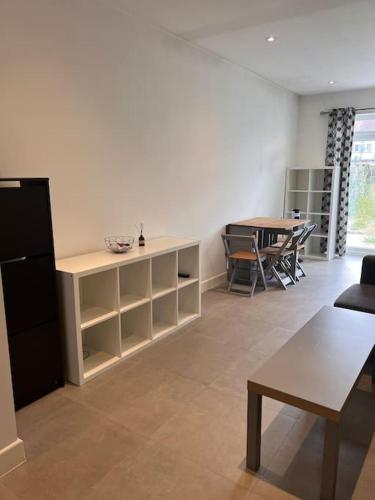 a living room with a table and a dining room at Modern One bedroom apartment in Greater London! in Hounslow