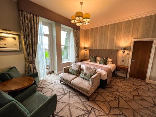 Un ou plusieurs lits dans un hébergement de l'établissement Lodore Falls Hotel & Spa