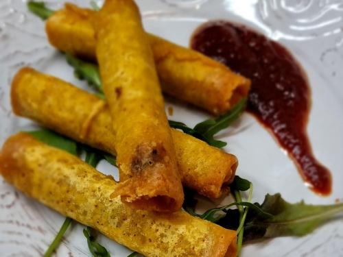 a plate of food with some fried food and sauce at Hotel Nautilos in Sozopoli