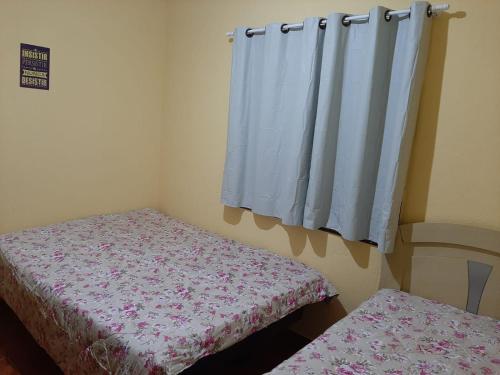 Cama o camas de una habitación en Casa em Campos do Jordão