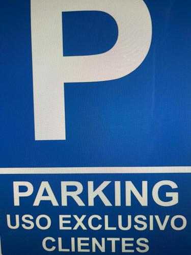a parking sign with a letter p on it at Fisterracons in Finisterre