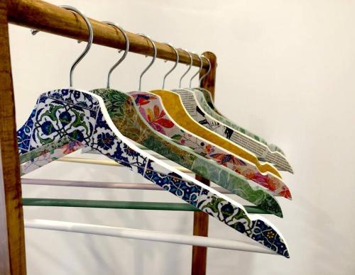 a pair of shoes are hanging on a rack at Portubide Bermeo in Bermeo