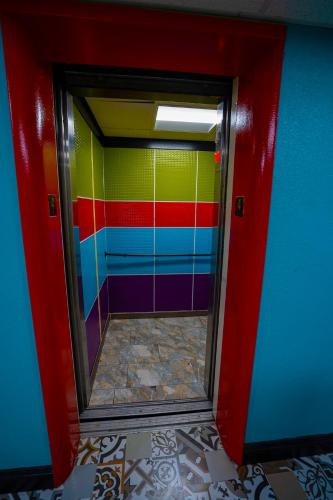 a colorful bathroom with a mirror in a room at Philly Inn & Suites in Philadelphia