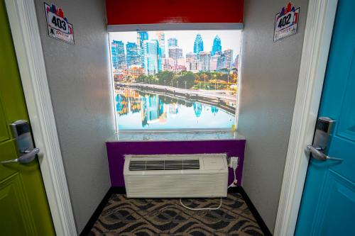 a window with a view of a city from a room at Philly Inn & Suites in Philadelphia