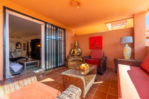 a living room with a couch and a table at Los Lagos Golf II Charming 3 bedroom apartment in Marbella in Marbella