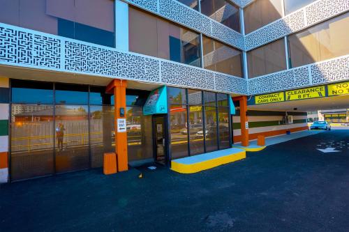 a building with a parking lot in front of it at Philly Inn & Suites in Philadelphia