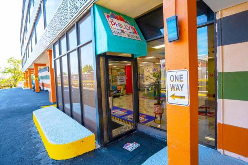 a one way sign in front of a store at Philly Inn & Suites in Philadelphia