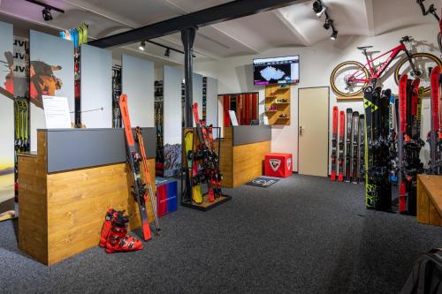 a room filled with lots of skis and snowboards at Rezidence Za Vodou - Ledňáček in Cerny Dul