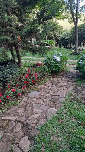 Taman di luar Aconchego da Roça