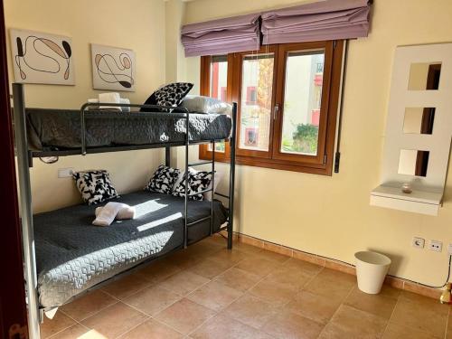 Posteľ alebo postele v izbe v ubytovaní Apartamento Saadia Golf and Beach