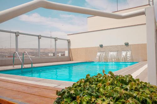 a swimming pool on top of a building at Dorado Hotel Boutique - Tacna in Tacna