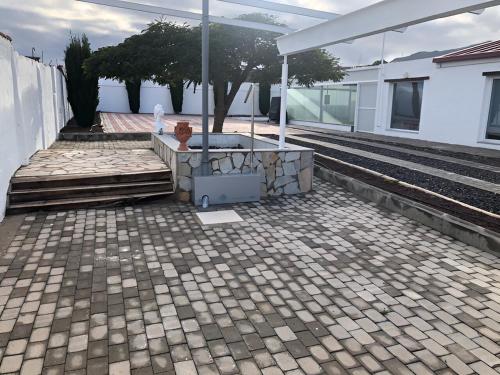 a patio of a house with a roof at Los Cipreses in Ingenio