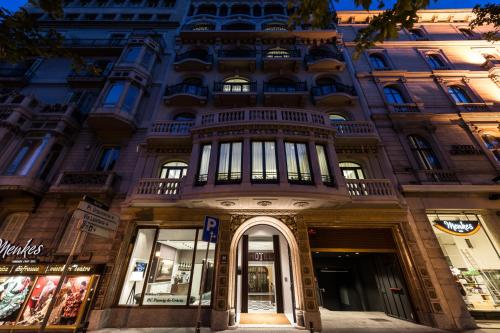 a building with a balcony on the front of it at Catalonia Passeig de Gràcia 4* Sup in Barcelona