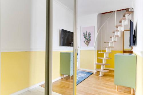 a room with a sliding glass door and a staircase at Duplex Moderne Cosy - Proche Porte d'Italie - Parking in Le Kremlin-Bicêtre