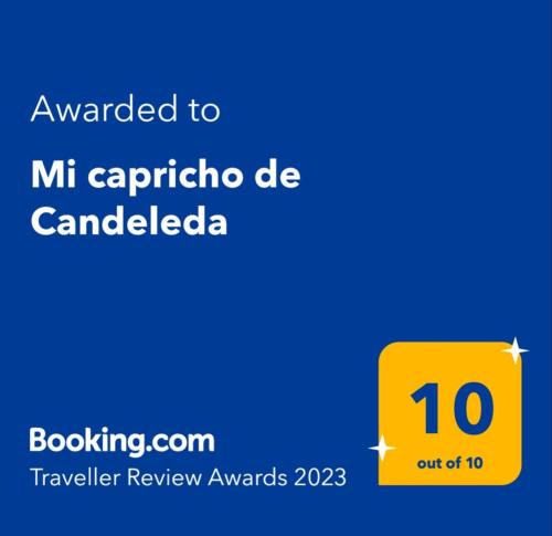 a yellow sign that reads awarded to mitt carrollatha de canada at Mi capricho de Candeleda in Candeleda