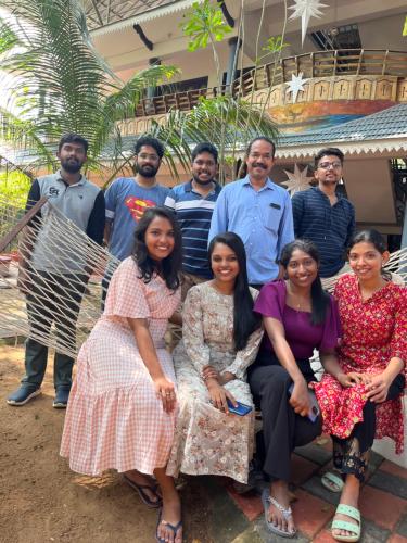 a group of people are posing for a picture at Marari Beach Villas in Mararikulam