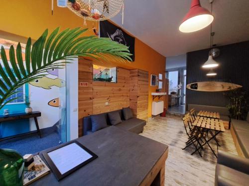 a living room with a couch and a table at Sardines and Friends Hostel 04 in Póvoa de Varzim