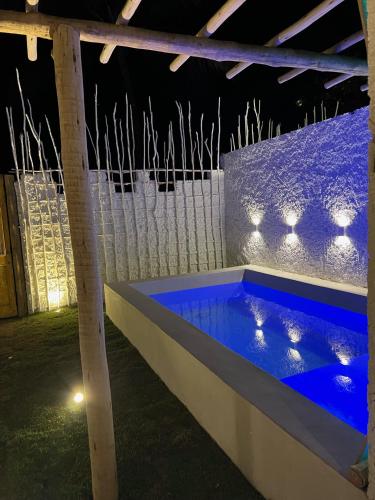 a hot tub in a building at night at Villas Taturé in São Miguel dos Milagres