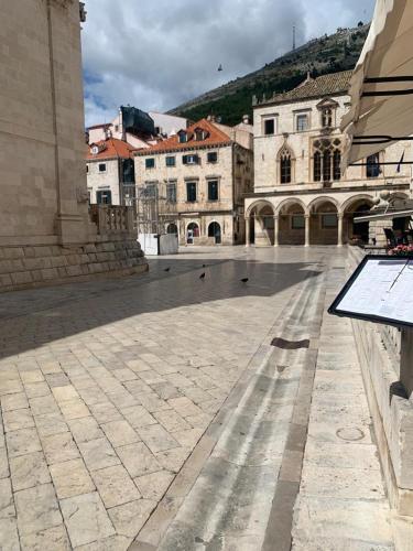 an empty courtyard in a city with buildings at Elephant in my room in Dubrovnik