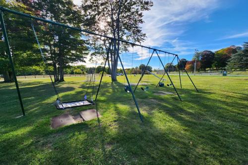 an empty swing set in a park at Heart & Soul Hideaway in Harbor Springs