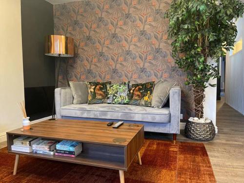 a living room with a couch and a coffee table at The Lounge in Newquay