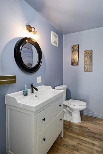 a bathroom with a white sink and a toilet at The Wesley Walla Walla in Walla Walla