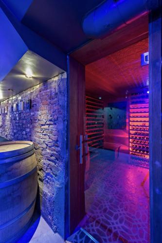 a wine cellar with a barrel and purple lights at The Wesley Walla Walla in Walla Walla