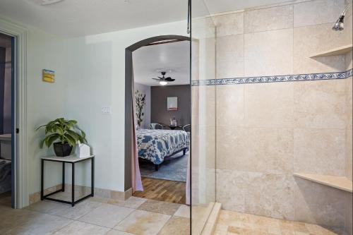 a bathroom with a shower and a bedroom with a bed at The Wesley Walla Walla in Walla Walla