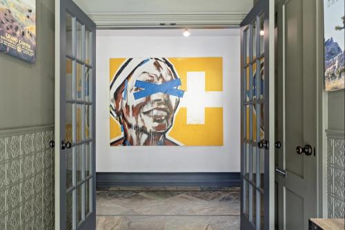 a hallway with a painting on the wall at The Wesley Walla Walla in Walla Walla