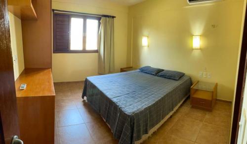 Säng eller sängar i ett rum på Chalé com Churrasqueira, 3Q - Praia de Zumbi RN Ch 16