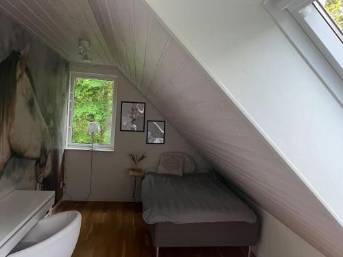 a room with a stairs with a bench and a window at Holiday Home BÅSTAD Sunday to Sunday 1 in Båstad
