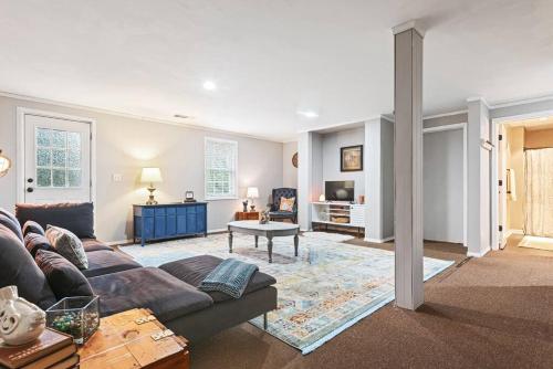 a living room with a couch and a table at Cozy basement apartment in Fayetteville