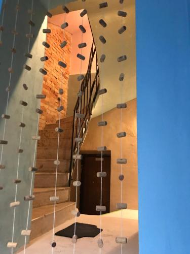 a spiral staircase with shoes on the wall at Downtown apartment in Timişoara