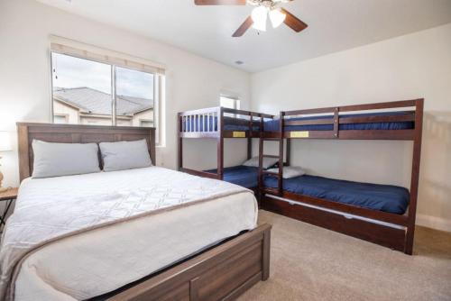 a bedroom with two bunk beds and a window at Zion Village Oasis by the Pool with Lazy River in Hurricane
