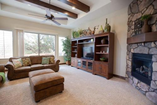 a living room with a couch and a fireplace at 1906 Pebble Beach Retreat in Washington